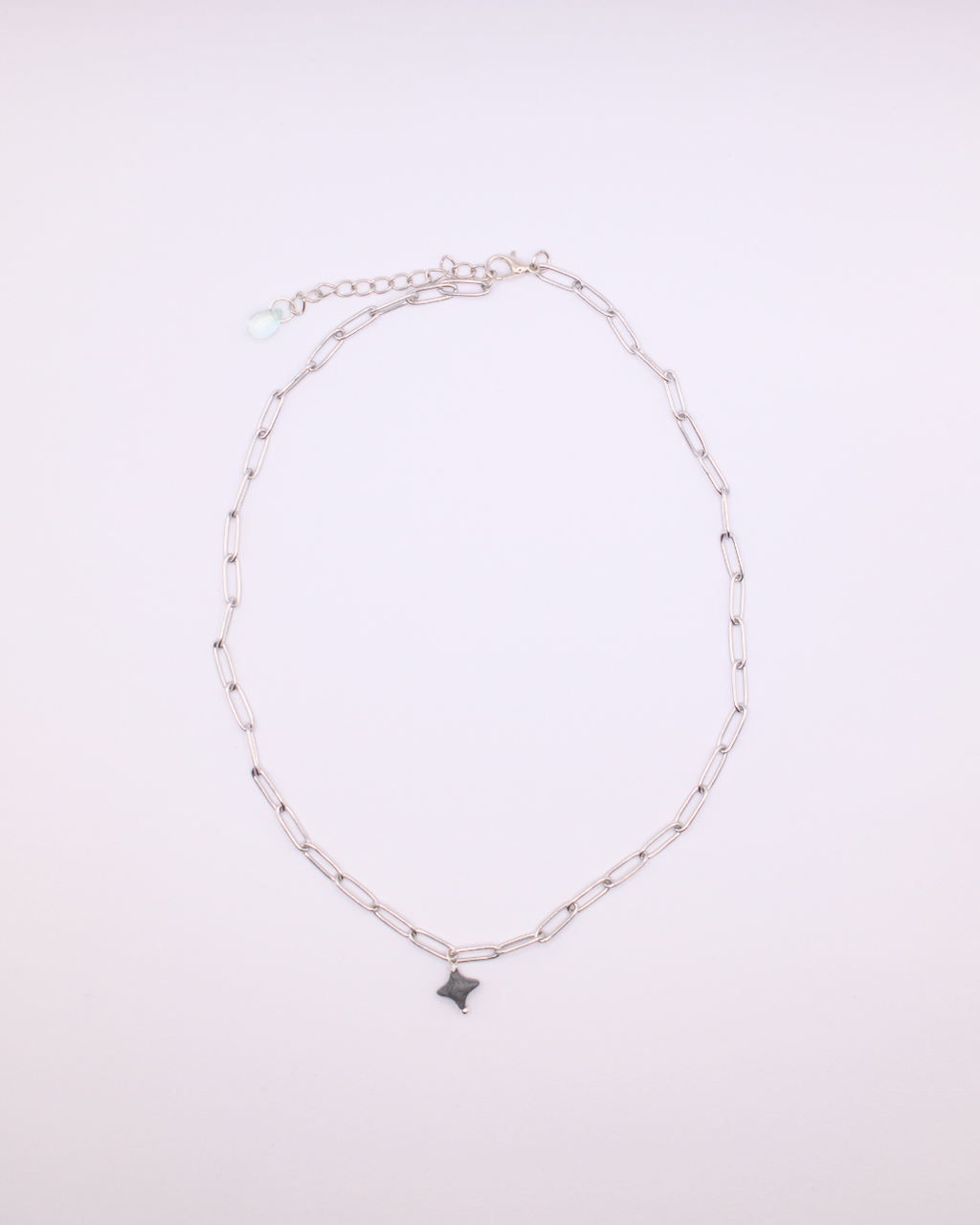 Silver stainless steel chain necklace with dainty stone cross charm. 